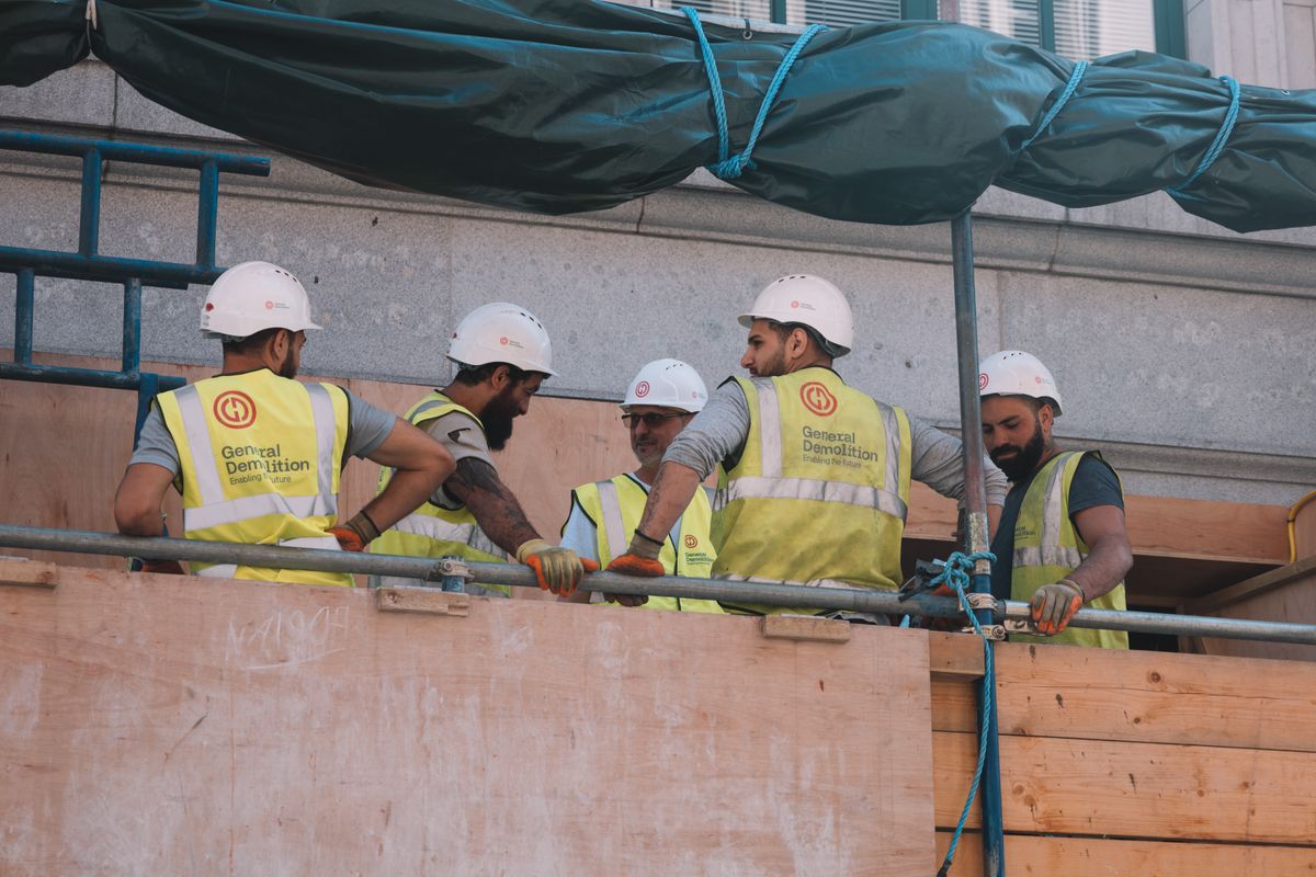 Construction managers reviewing plans on a jobsite
